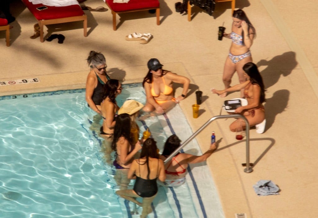 Lori Chavez-DeRemer (in yellow bikini) and several women at a pool in Las Vegas. Lori Chavez-DeRemer (in yellow bikini) and several women at a pool in Las Vegas.