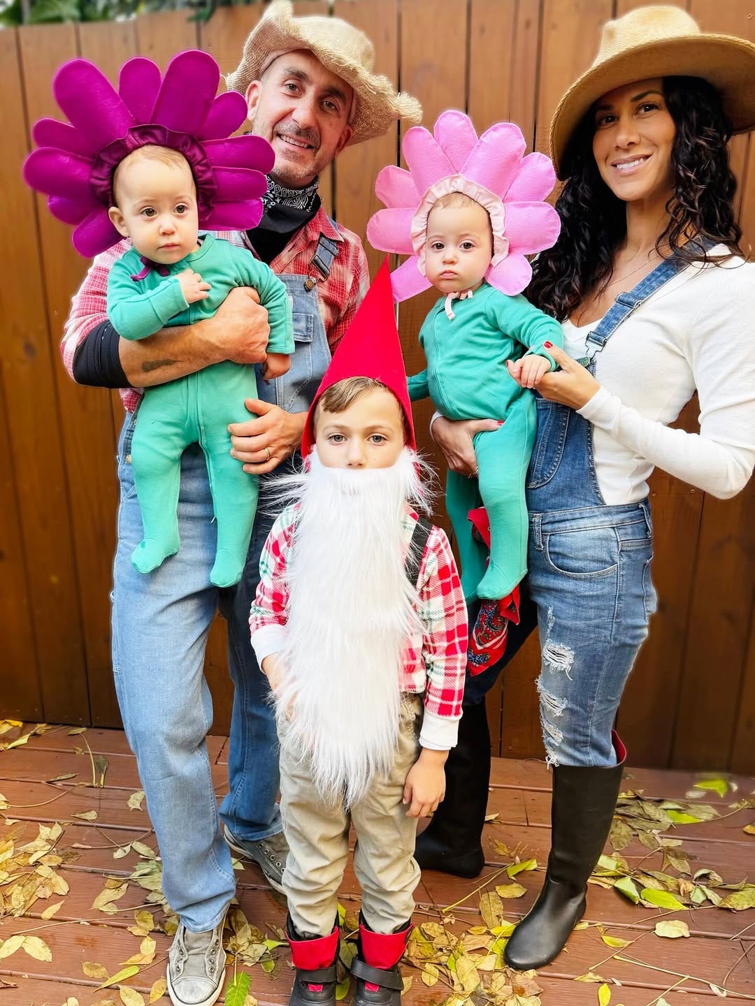 Marc and his family dressed up for Halloween as farmers, flowers and a garden gnome