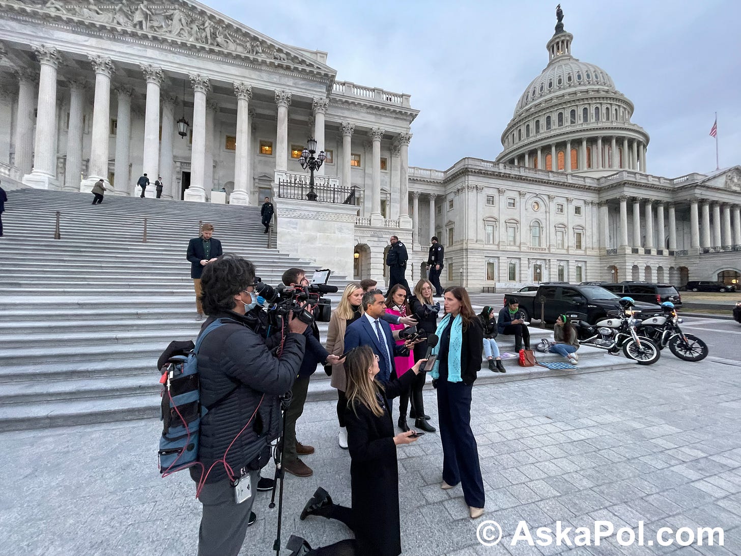 Reporters surround a congresswoman who's answering their questions underneath the US Capitol Dome. Photo: Matt Laslo © askapol.com 
