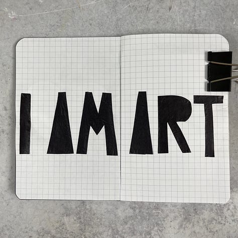 creative art journal pages in a small notebook