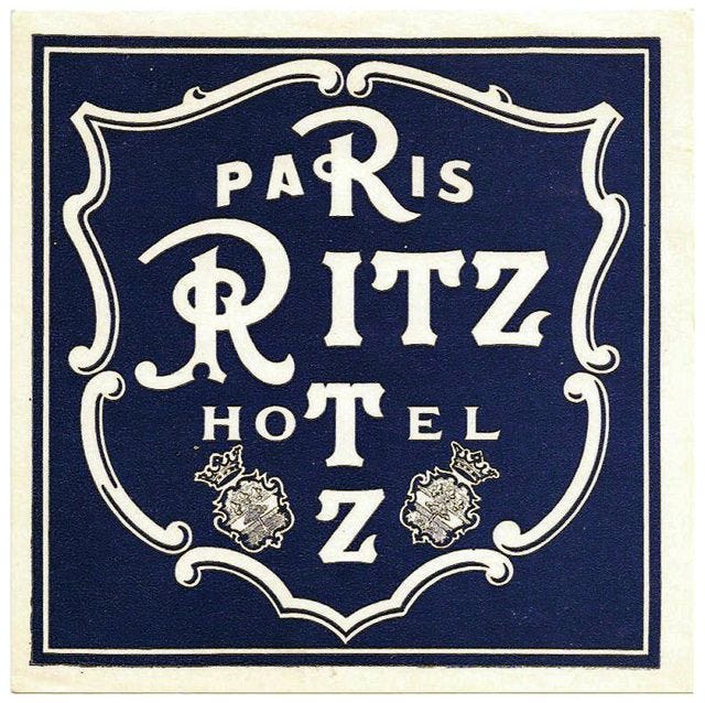 This may contain: the paris ritz hotel logo is shown in blue and white, with an ornate frame around it