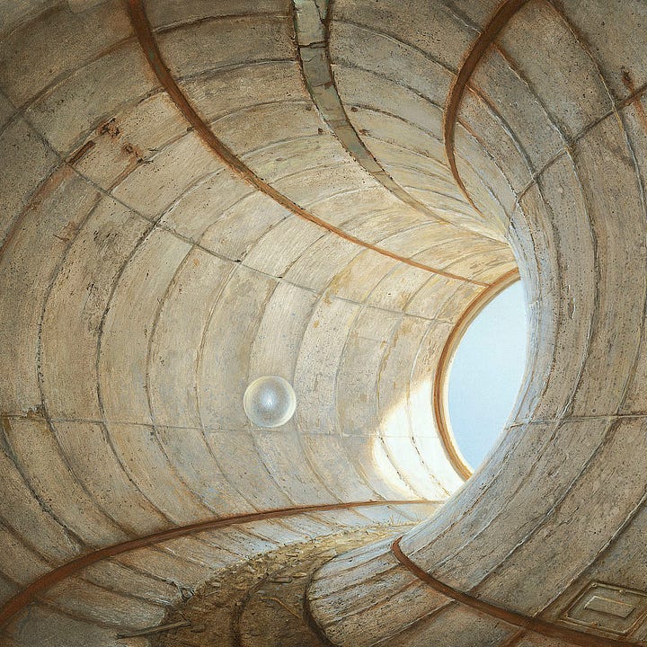 LEFT: Detail from OUT OF THE SHADOWS featuring a sphere floating around the bend of a curving concrete passage toward open air. Strips of rusted metal trim run parallel to a path of dirt cut into the stone floor.  RIGHT: Detail from OUT OF THE SHADOWS featuring a transparent sphere containing a solitary flame hovering against the wall of a curving concrete passage. A weathered 5-pointed star is painted in yellow. The tunnel is made of concrete panels with the seams between raised on the stone surface like scar tissue.