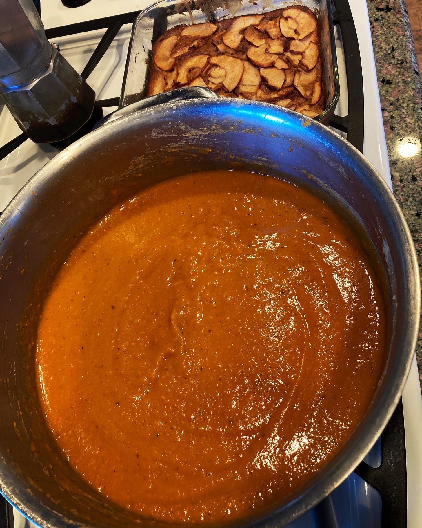 thick orange-colored soup and apple cake