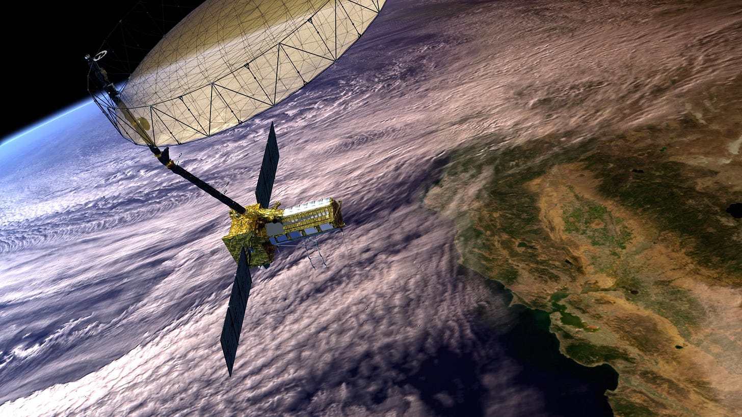 an artist's rendering of NISAR in orbit over california