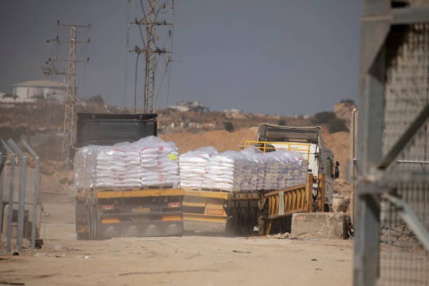 Trucks heading into the Gaza Strip as they are carrying humanitarian aid during a press tour of the Erez Crossing organized by the Israel Defense...