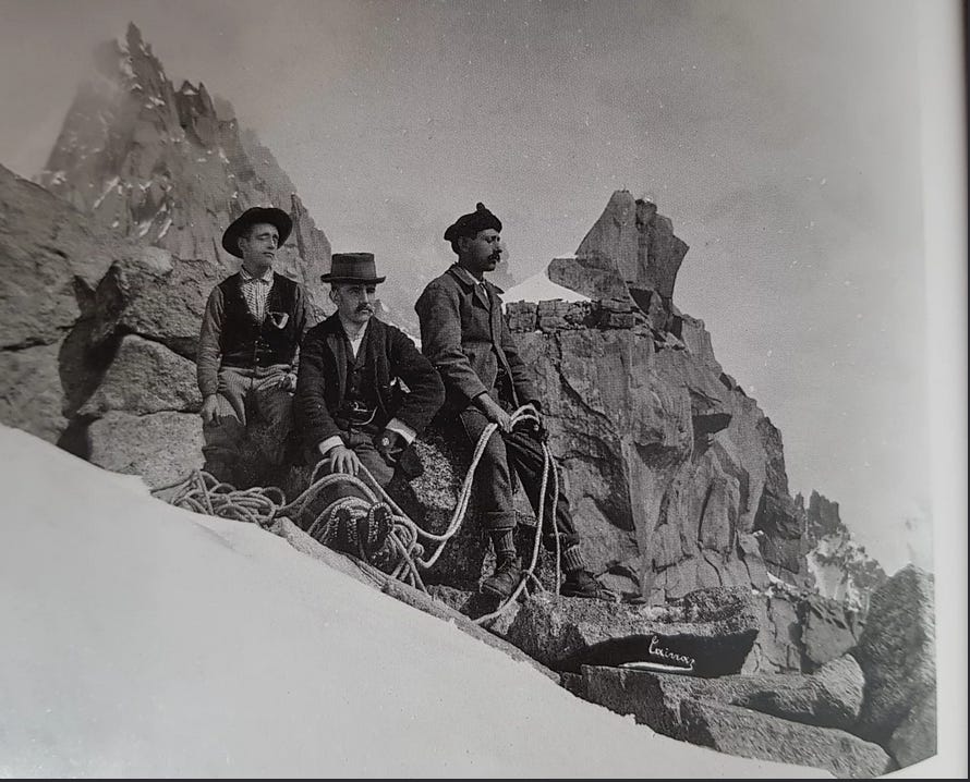 old photo, three blokes sitting in the snow