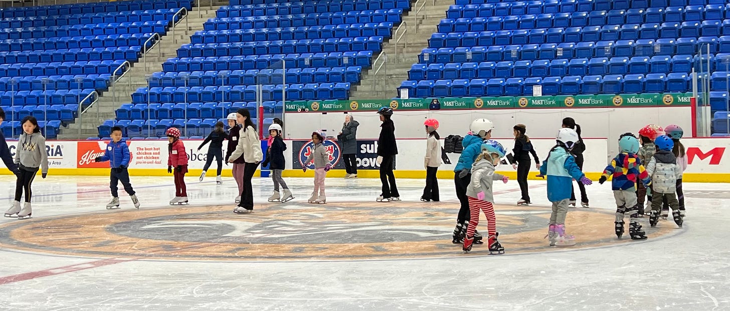 May be an image of 14 people and people playing hockey