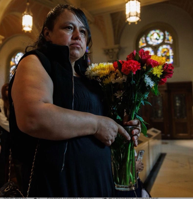 A person holding flowers in a church

AI-generated content may be incorrect.