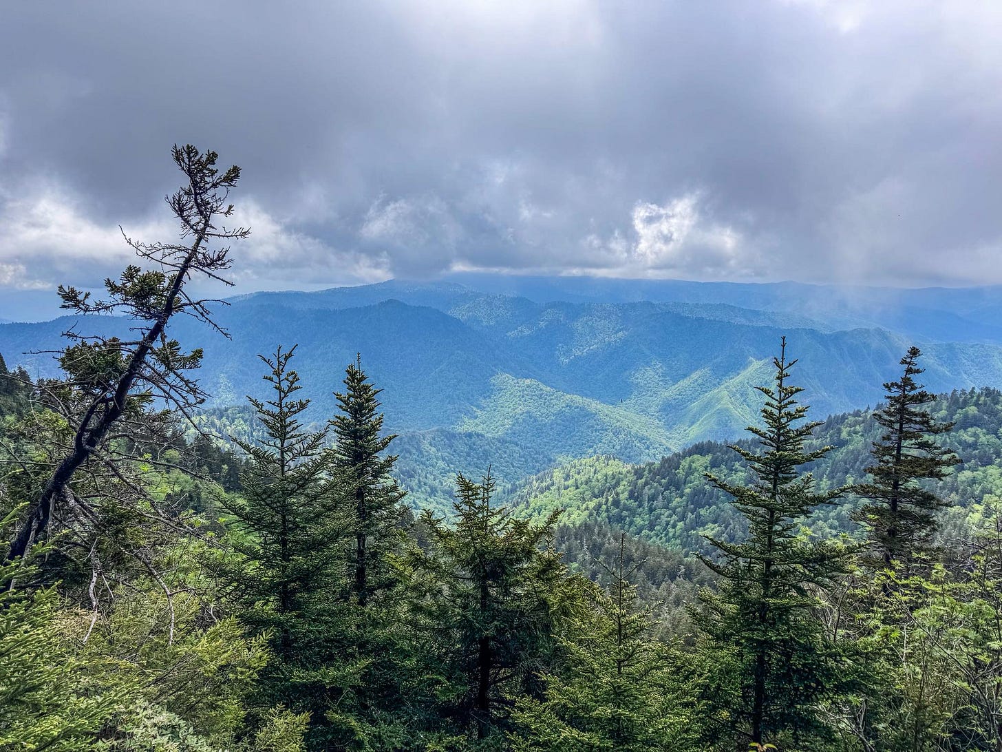 May be an image of mountain and fog May be an image of mountain and fog