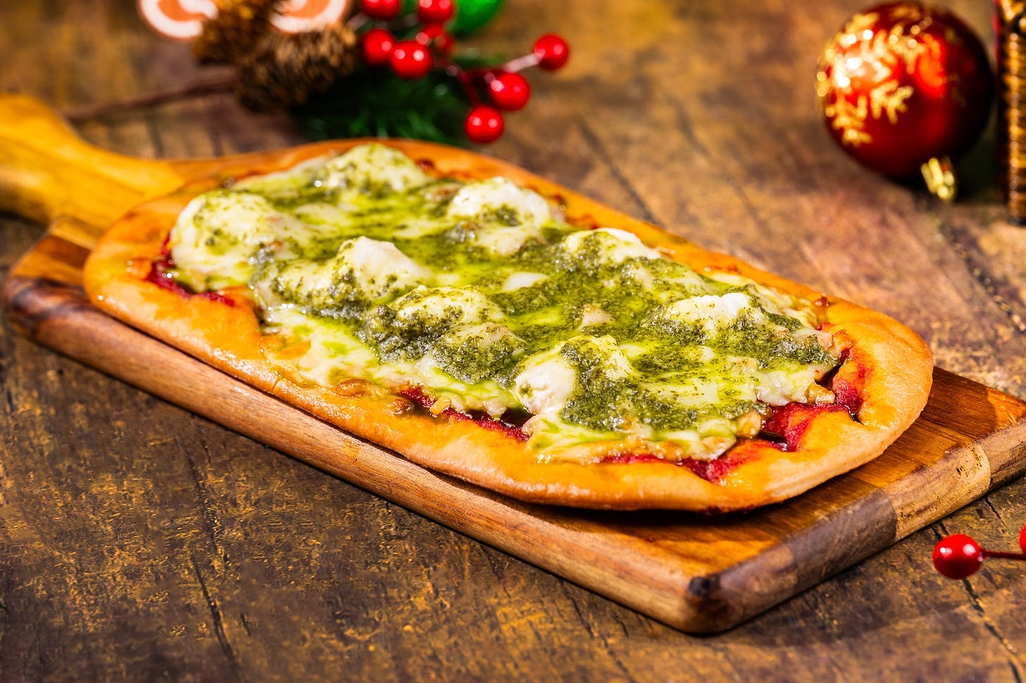 Italian Sausage and Meatball Lasagna Flatbread with a three-cheese Italian blend and ricotta topped with pesto