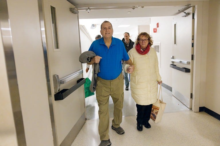 Tim Andrews and his wife, Karen, smile as they leave Massachusetts General Hospital on Saturday, February 1, 2025.