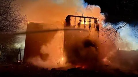 Essex Fire and Rescue Service A part of the hotel, which can be seen badly damaged, is engulfed in smoke and a bright orange glow from the flames of the fire.