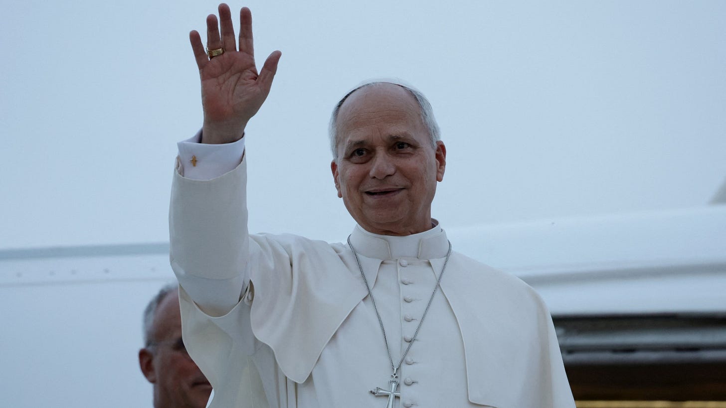 Pope Leo XIV waves from the door of the papal plane Pope Leo XIV waves from the door of the papal plane
