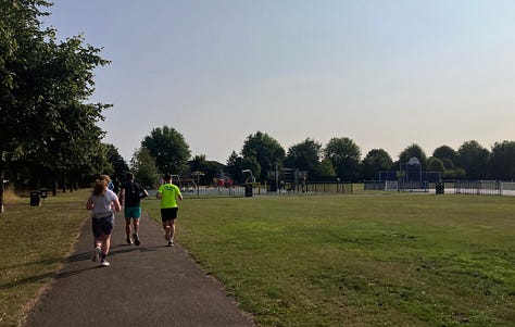 Different views of the course, including a narrow section and a sign marking straight on after one lap, right to the finish after the second