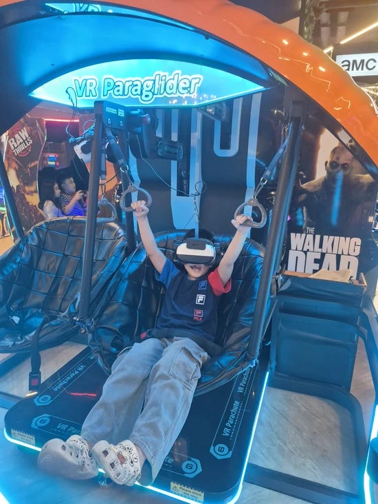 little boy playing a VR game