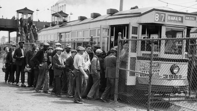 Factory workers board Baker-Van Dyke streetcar No. 87 in Detroit circa 1930.