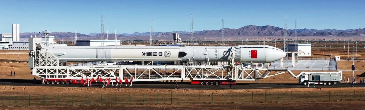 The Long March 12B Y1 vehicle being transported to its launch pad atop of a transporter-erector between its Jiuquan Satellite Launch Center facilities. The Long March 12B Y1 vehicle being transported to its launch pad atop of a transporter-erector between its Jiuquan Satellite Launch Center facilities.