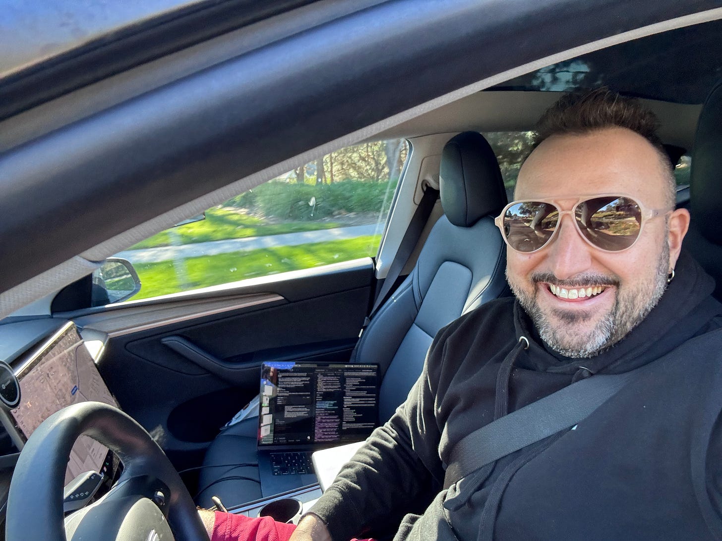 vibe coding with my computer riding shotgun in a self-driving Tesla