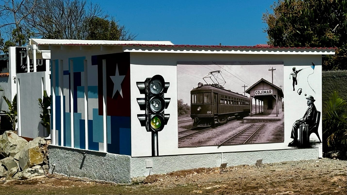A mural of a train and a train

Description automatically generated
