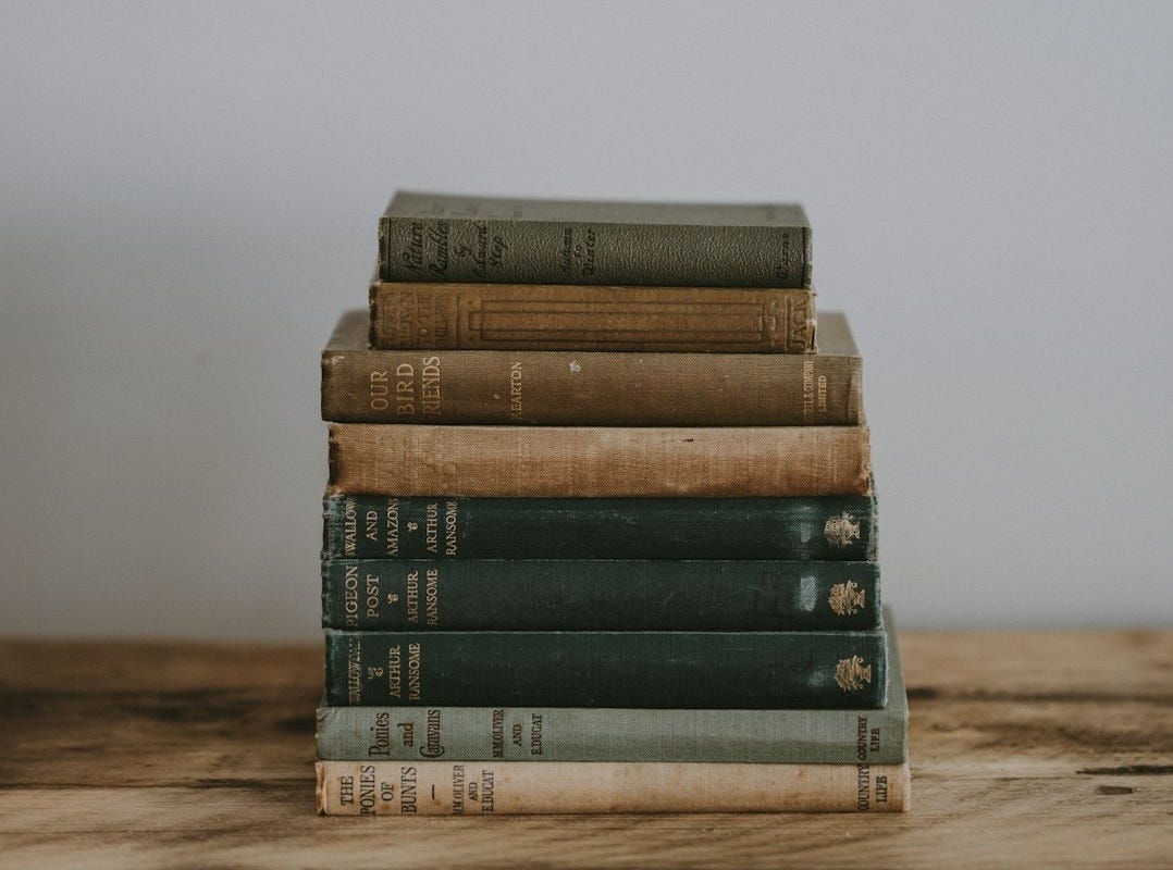 pile of Bible on brown surface