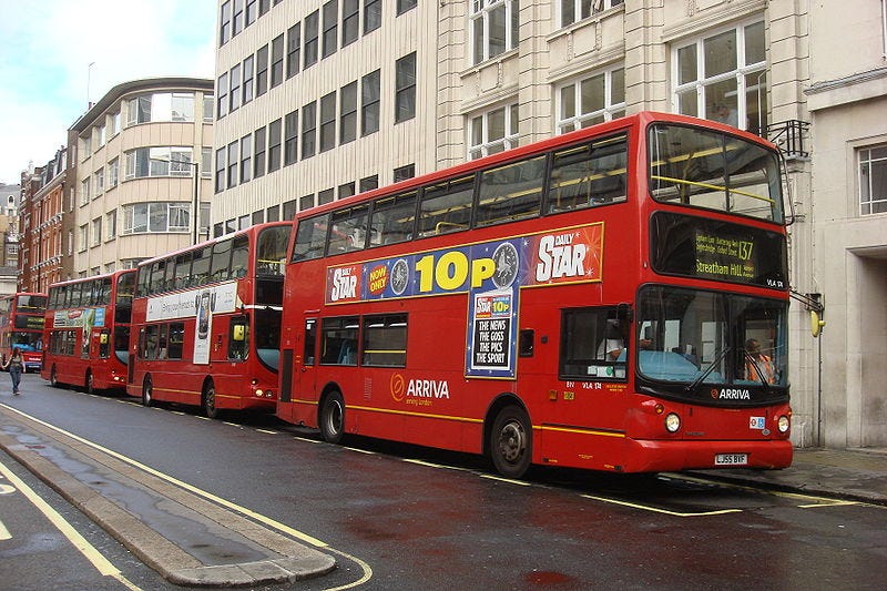 A line of red London Buses on Oxford Street A line of red London Buses on Oxford Street