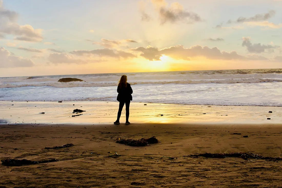 woman stood on beach