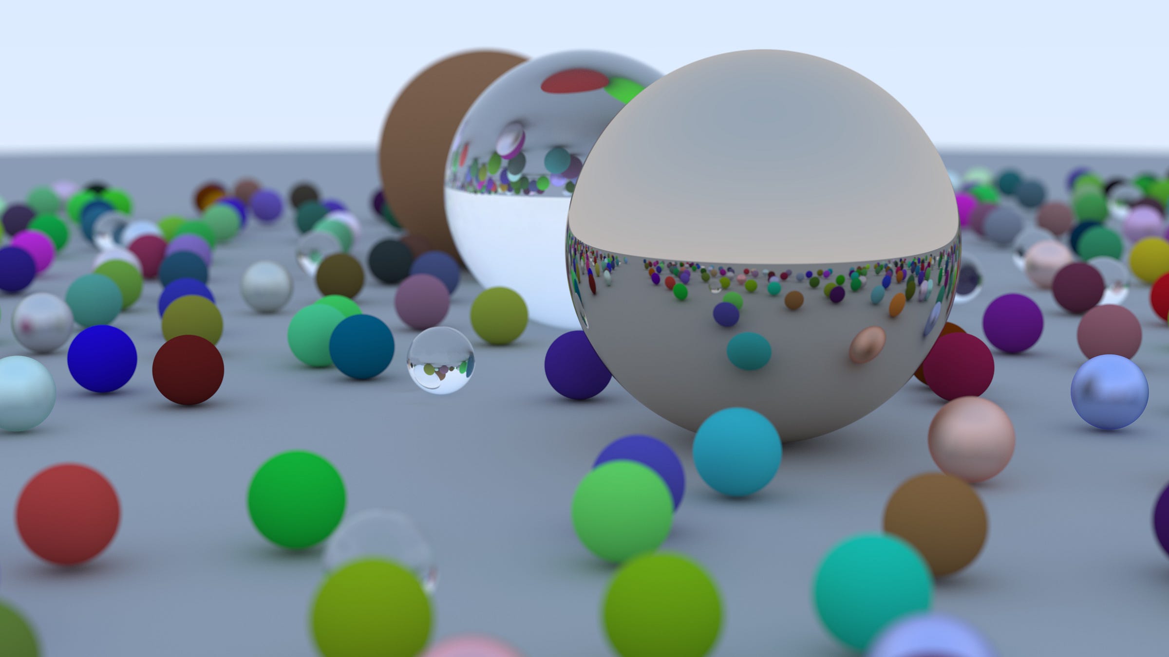 A brown diffuse sphere, glass sphere, and metal sphere surrounded by many small colored spheres. A brown diffuse sphere, glass sphere, and metal sphere surrounded by many small colored spheres.