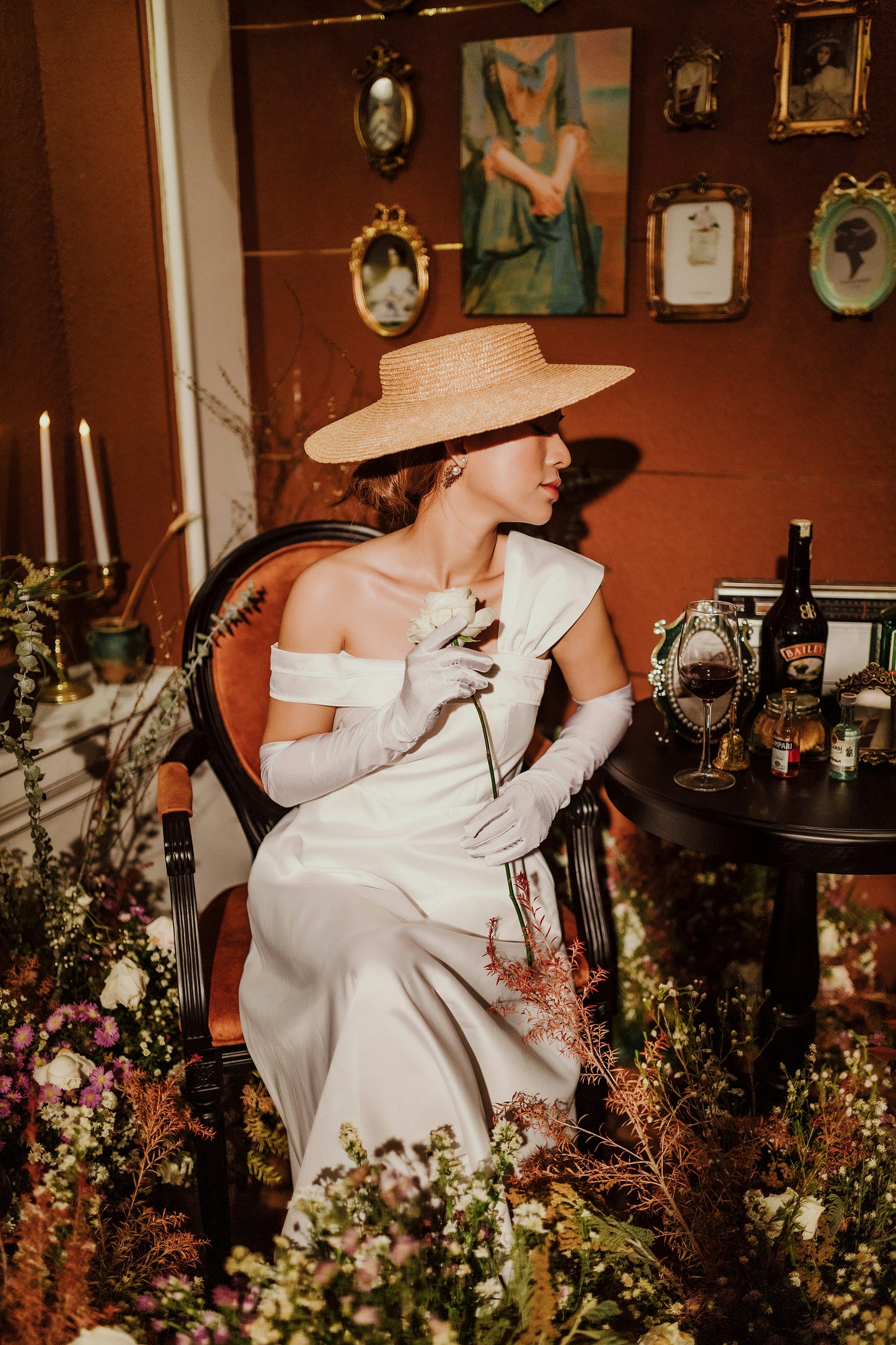 Woman sitting in chair with a hat 