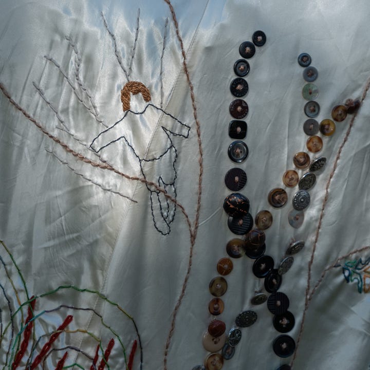 Diptych: On the left - Textured olive green seaweed emerges. In the background dark green water with ripples of sand; On the right: A child is embroidered on a tree branch in the upper left quadrant; to her right, rows of buttons emerge, looking like seaweed or grass.