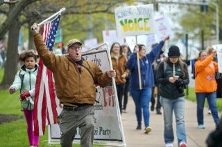 FILE - Opponents of a bill to repeal Connecticut's religious exemption for required school vaccinations march down Capitol Avenue before the State Senate voted on legislation on April 27, 2021, in Hartford, Conn. A federal appeals court on Friday, Aug. 4, 2023, upheld a 2021 Connecticut law that eliminated the state’s longstanding religious exemption from childhood immunization requirements for schools, colleges and day care facilities. (Mark Mirko/Hartford Courant via AP, File) FILE - Opponents of a bill to repeal Connecticut's religious exemption for required school vaccinations march down Capitol Avenue before the State Senate voted on legislation on April 27, 2021, in Hartford, Conn. A federal appeals court on Friday, Aug. 4, 2023, upheld a 2021 Connecticut law that eliminated the state’s longstanding religious exemption from childhood immunization requirements for schools, colleges and day care facilities. (Mark Mirko/Hartford Courant via AP, File)