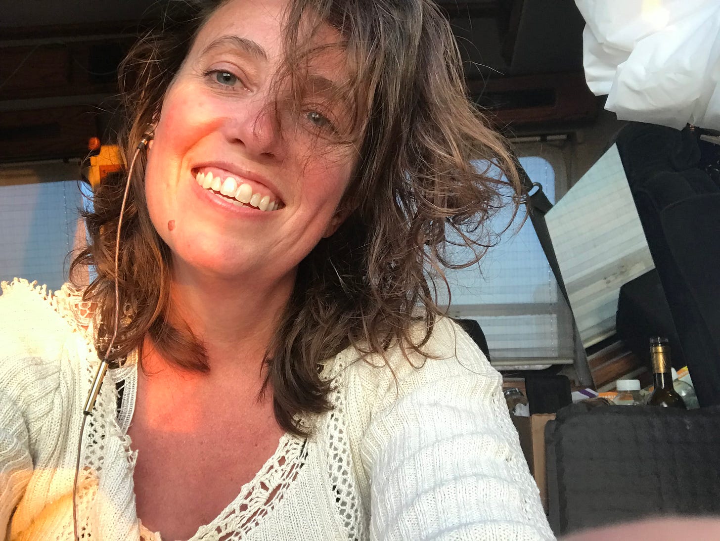 The author sitting in the barn door of her then new van Ruby