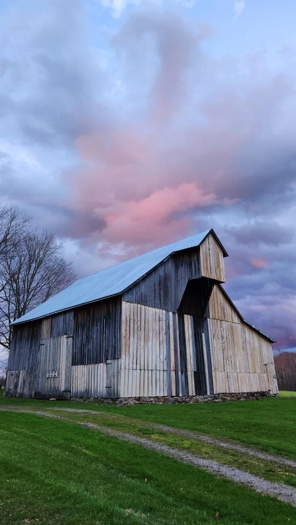 Barn with pink cloud.