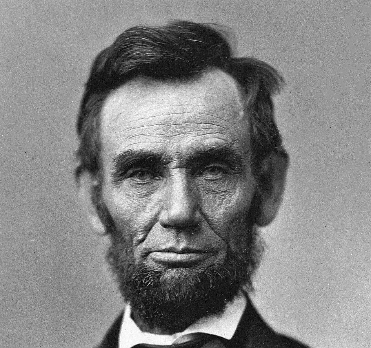 Portrait of a bearded Abraham Lincoln showing his head and shoulders