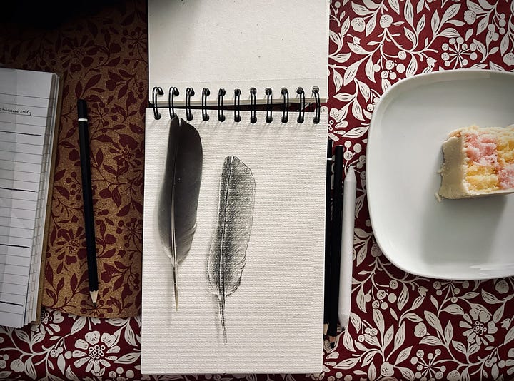 A loose marker landscape with blues and greens, two line portraits of my daughters, a realistic drawing of a feather with a real feather on top
