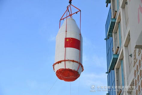 The fairing of the Long March 2C heading to the launch site and being lifted during integration, along with the second-stage being lifted for integration.