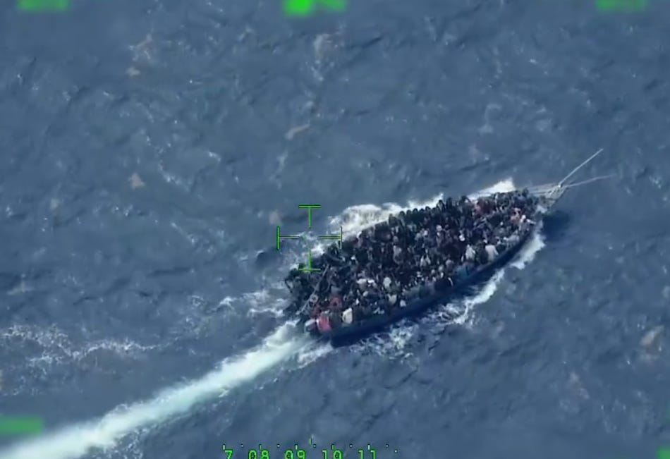 Those aboard the boat, which was limping along on just one engine, were frantically bailing out water before the vessel was observed to lose all power.(US Customs & Border Protection photo) Those aboard the boat, which was limping along on just one engine, were frantically bailing out water before the vessel was observed to lose all power.(US Customs & Border Protection photo)