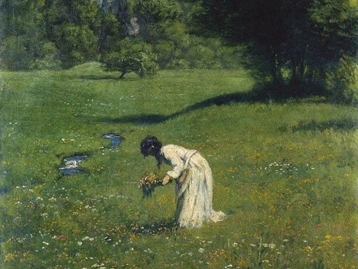 This may contain: an image of a woman picking flowers in a field with trees and grass behind her