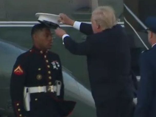 Trump stopping to pick up Marine's hat blown away by wind is president's latest viral moment - ABC News Trump stopping to pick up Marine's hat blown away by wind is president's latest viral moment - ABC News