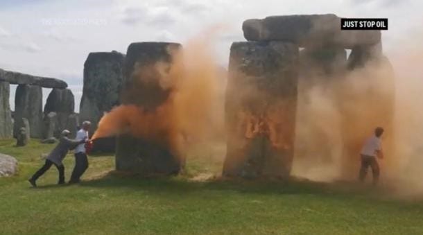 Screenshot of video showing vandals spray painting Stonehenge Screenshot of video showing vandals spray painting Stonehenge