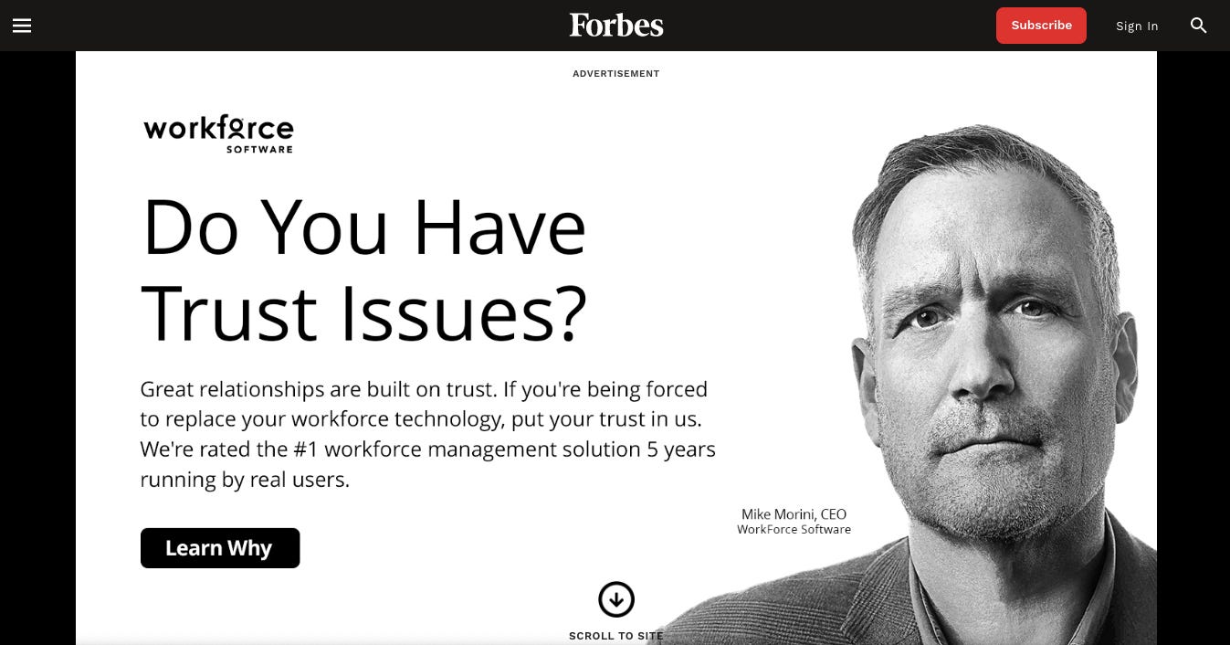 A large ad for Workforce Software prompts readers to "scroll to site" because it covers the whole homepage