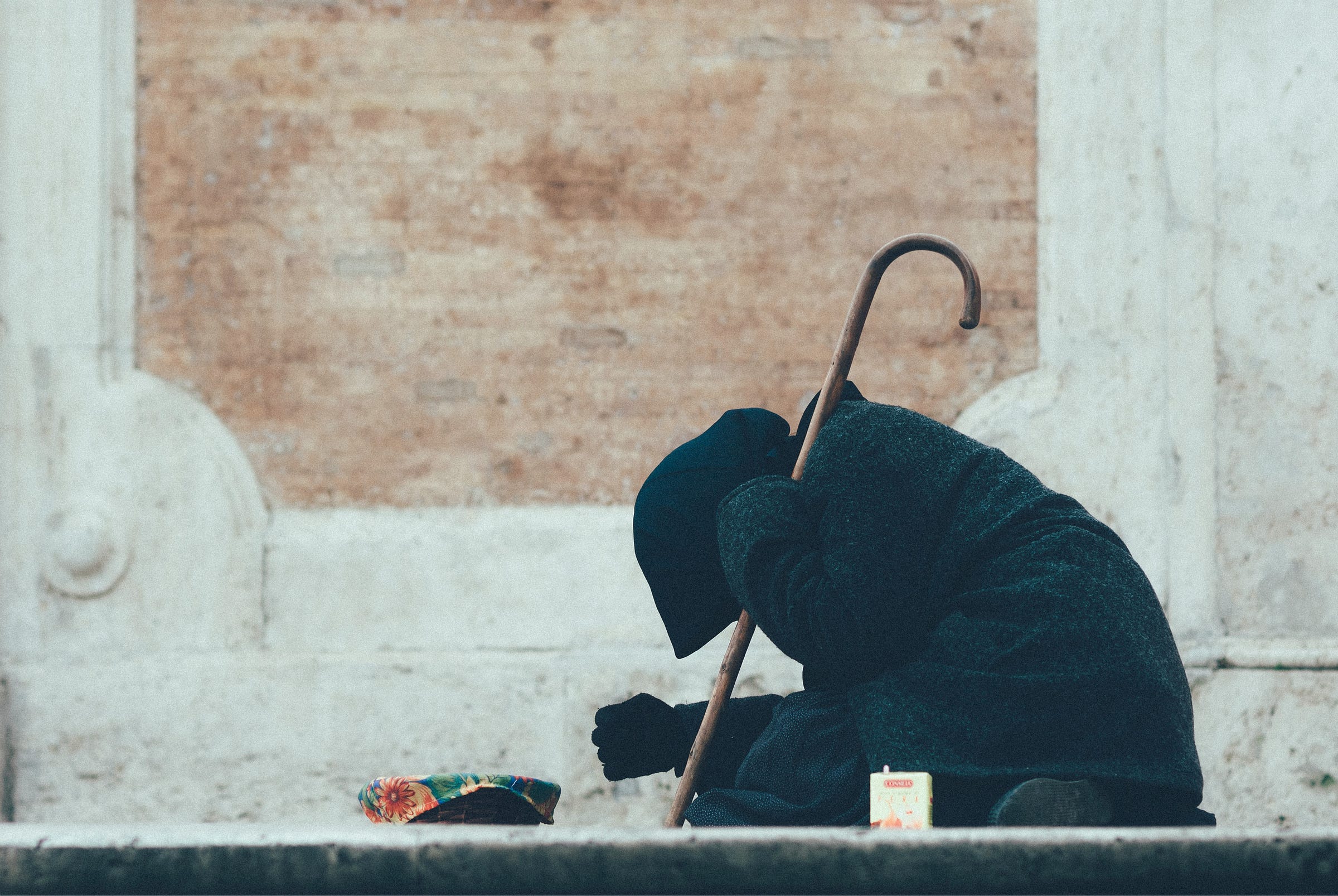 A beggar on a roadside A beggar on a roadside