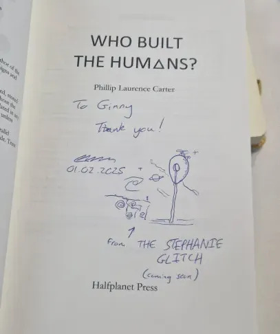 A drawing of an egg-shaped UFO hovering by a cliff face. The image is drawn into a signed book "WHO BUILT THE HUMANS" by Phillip Carter.