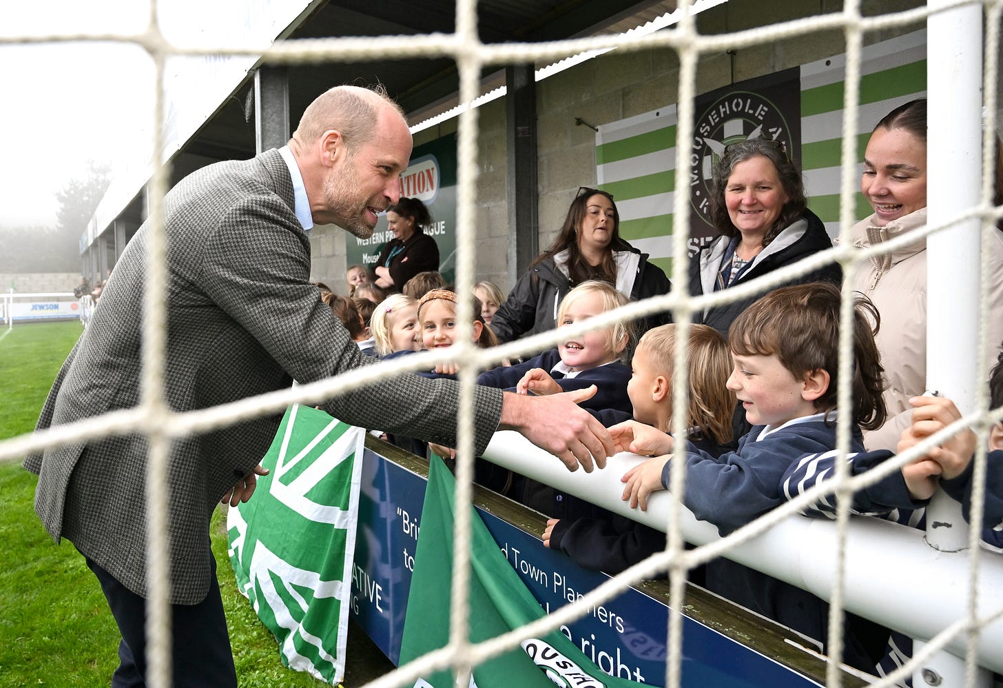 Prince William shaking a boy's hand Prince William shaking a boy's hand