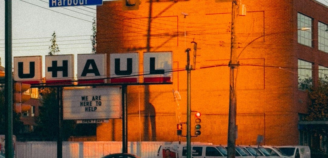 a large orange building sitting on the side of a road