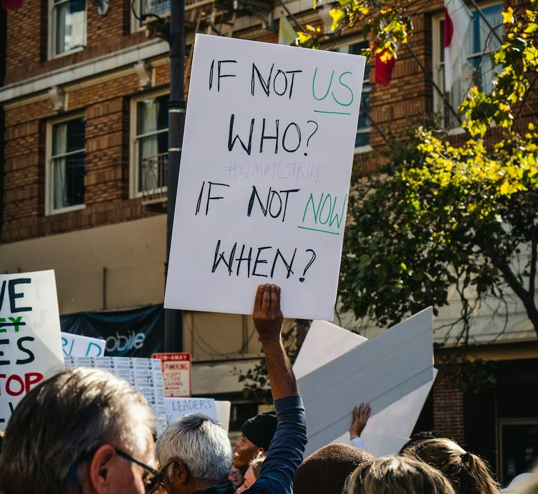 man holding if not us who poster
