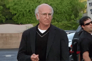 Larry David looking unsure if he is happy or unhappy