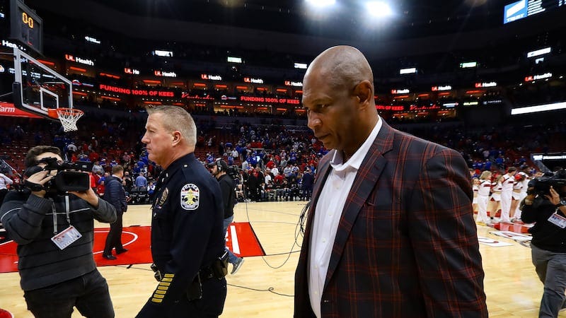 Louisville head basketball coach Kenny Payne leaves the court after Louisville falls to...