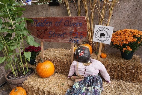Scarecrows wear old clothing, colourful accessories, and funny expressions on their faces as they stand propped up against lampposts and other landmarks in Charlottetown.