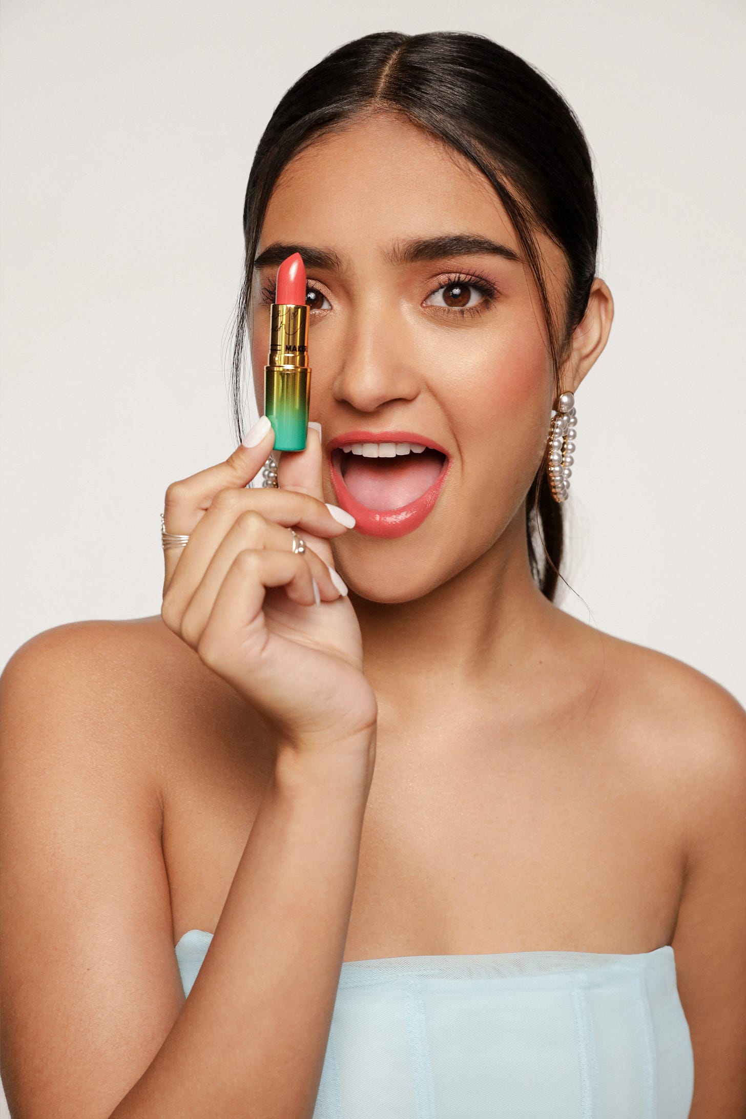 Miami-based creator Xime Ponch, known for her unfiltered Gen Z beauty content, posing in a vibrant Miami setting. Featuring natural, dewy skin and a relatable aesthetic for The Beauty Ed®.