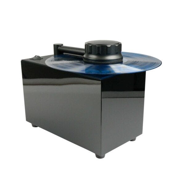 Manufacturer product image of a black Record Doctor cleaner with a record and clamp